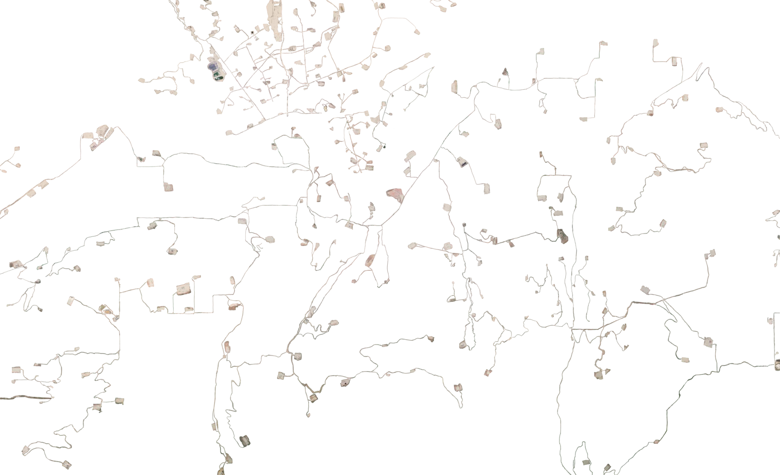 detail image of a larger cutout of satellite imagery of a tar sands mine, with waste ponds, buildings and roads visible