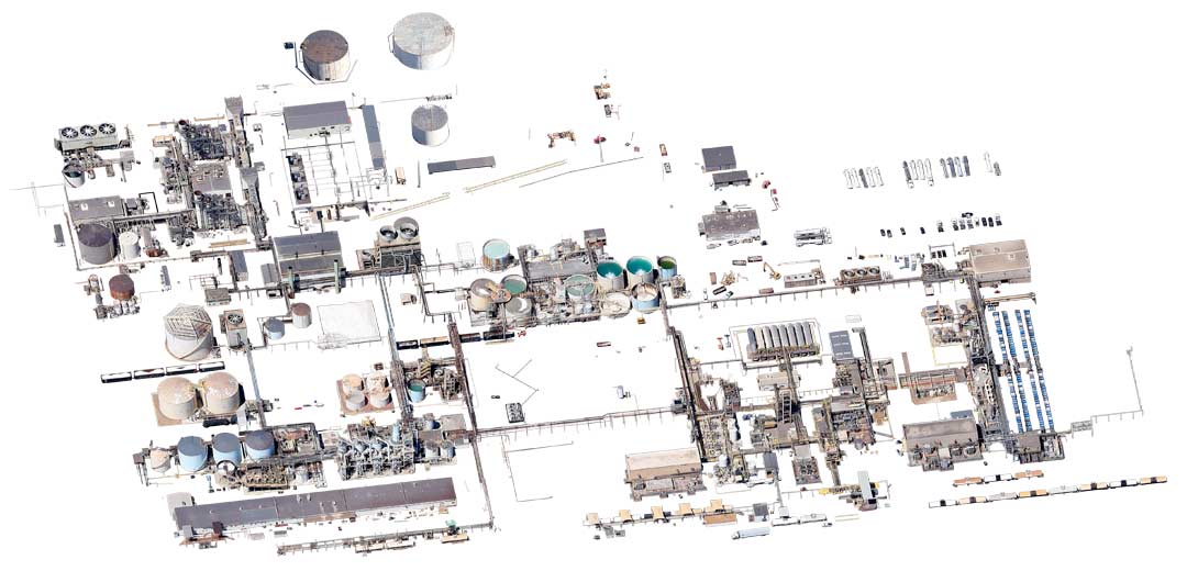 Isolated satellite imagery of a chemical processing plant, including pipelines and trucks