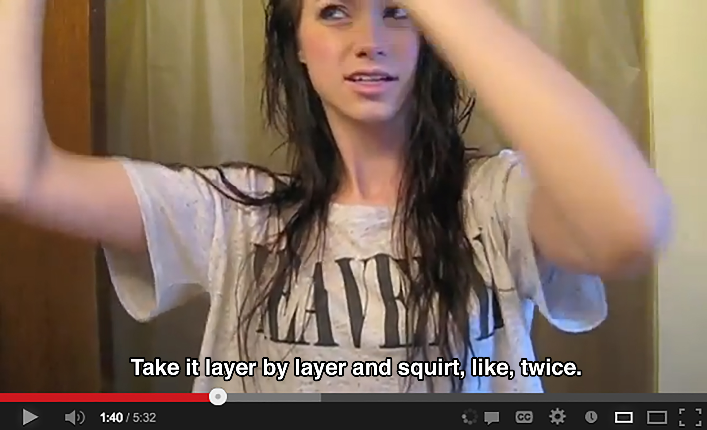 A teenager holds a section of her hair up offscreen and says: Take it layer by layer and squirt, like, twice.