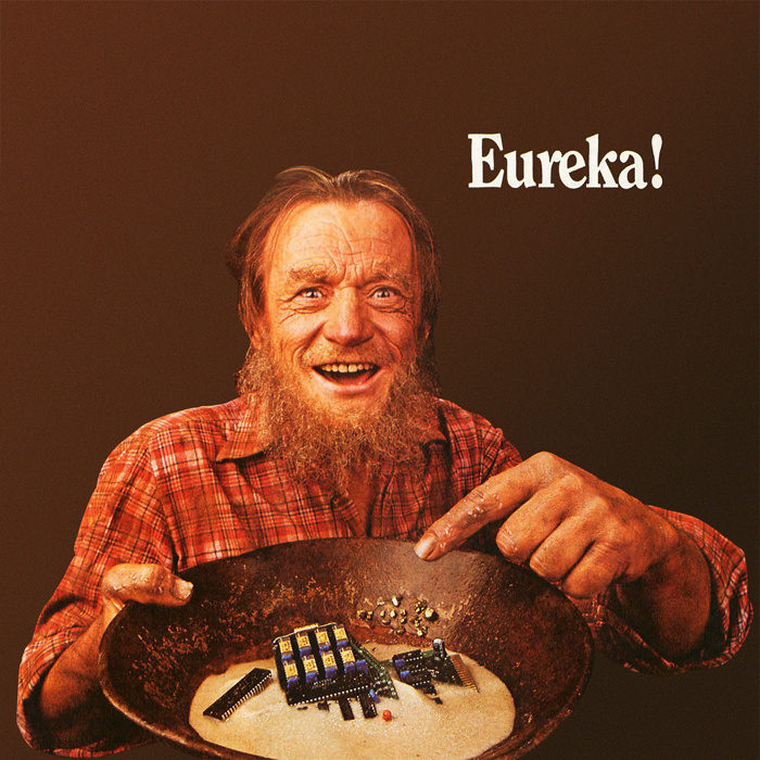 An old gold miner pointing to computer chips in his pan and saying, Eureka!