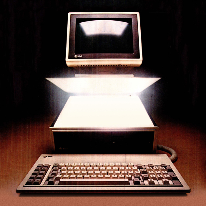 An old computer, with the middle part opening up and glowing white