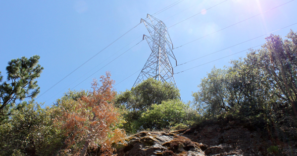 An electrical transmission tower in the mountains