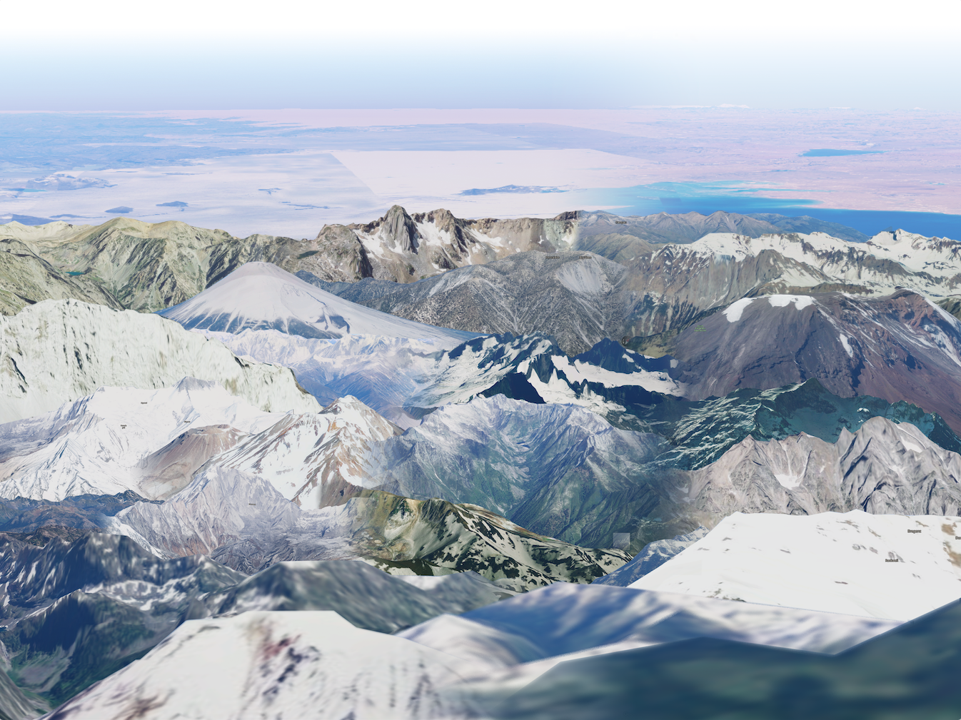 A digital collage of mountains from Google Earth, some high resolution and some low resolution, with a flat landscape extending into the background and a light blue sky. The different sets of mountains blend into each other along gradients and preserve some of the artifacts of Google Earth, like labels, squares of different colors, and the compass.